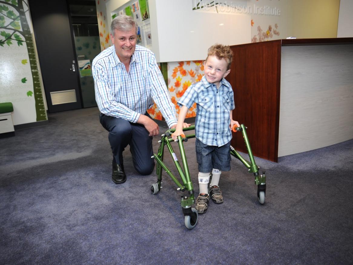 Professor Alastair MacLennan with Mattthew Reinerstein who has cerebral palsy